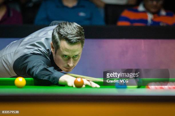 Alfie Burden of England plays a shot during his first round match against Ding Junhui of China on day two of Evergrande 2017 World Snooker China...