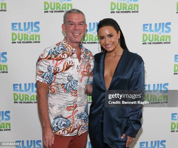 Radio host Elvis Duran and recording artist Demi Lovato pose for a picture during the "The Elvis Duran Z100 Morning Show" at Z100 Studio on August...