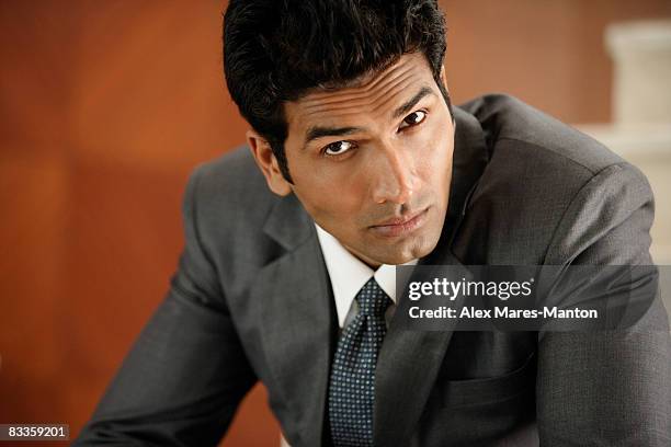 businessman with serious expression - pensive indian man stock pictures, royalty-free photos & images