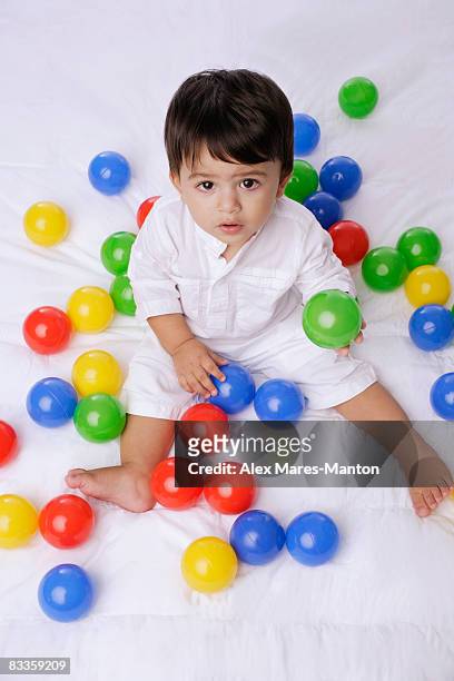 baby boy playing with balls - alex boys stockfoto's en -beelden