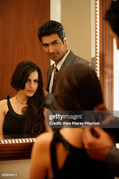 couple looking into mirror - stereotypically upper class stock pictures, royalty-free photos & images