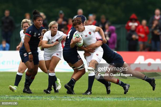 Sarah Hunter of England is tackled by Sara Parsons of USA during the Women's Rugby World Cup Pool B match between England and USA at Billings Park...