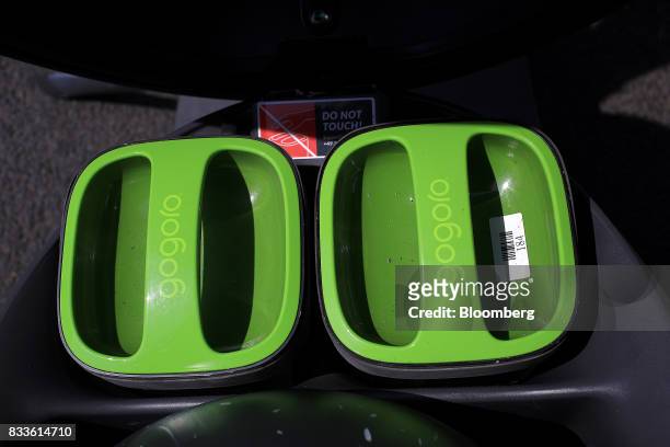 The Gogoro Inc. Logo sits on battery covers on a Coup eScooter electric hire vehicle, operated by Robert Bosch GmbH, in Berlin, Germany, on Thursday,...