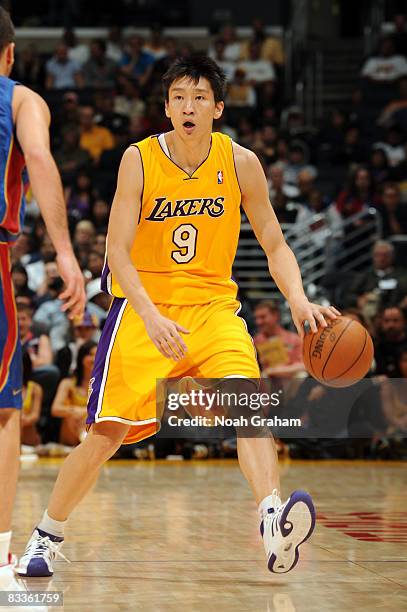 Sun Yue of the Los Angeles Lakers drives with the ball against Regal FC Barcelona at Staples Center on October 18, 2008 in Los Angeles, California....