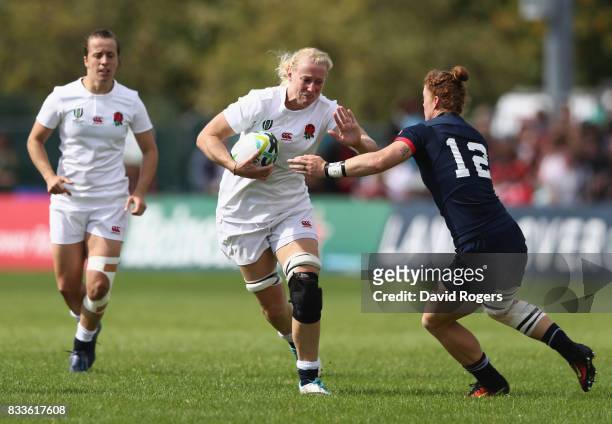 Tamara Taylor of England is tackled by Alev Kelter of USA during the Women's Rugby World Cup Pool B match between England and USA at Billings Park...