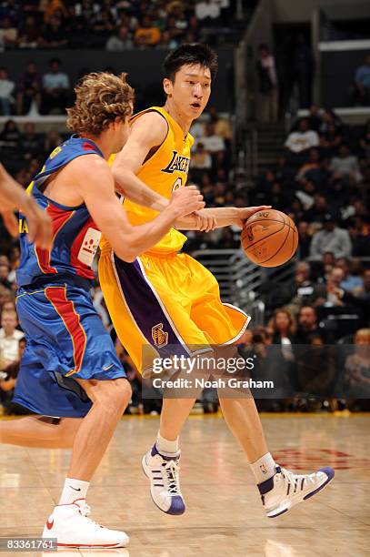 Sun Yue of the Los Angeles Lakers drives with the ball against Regal FC Barcelona at Staples Center on October 18, 2008 in Los Angeles, California....