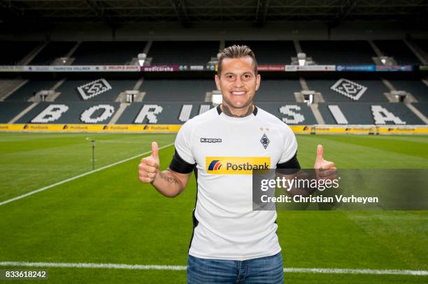 Raul Bobadilla pose with his new shirt after he signs a new contract for Borussia Moenchengladbach at Borussia-Park on August 17, 2017 in...