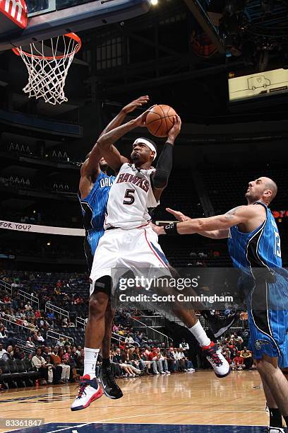 Josh Smith of the Atlanta Hawks goes for the basket against the Orlando Magic at Philips Arena on October 20, 2008 in Atlanta, Georgia. NOTE TO USER:...