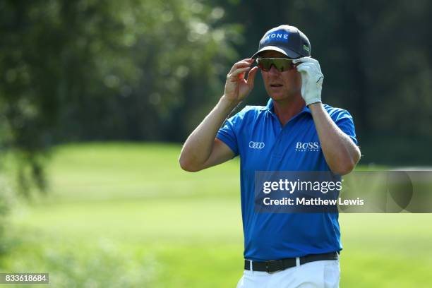 Mikko Ilonen of Finland walks off the 11th green after winning his match during round one of the Saltire Energy Paul Lawrie Matchplay at Golf Resort...