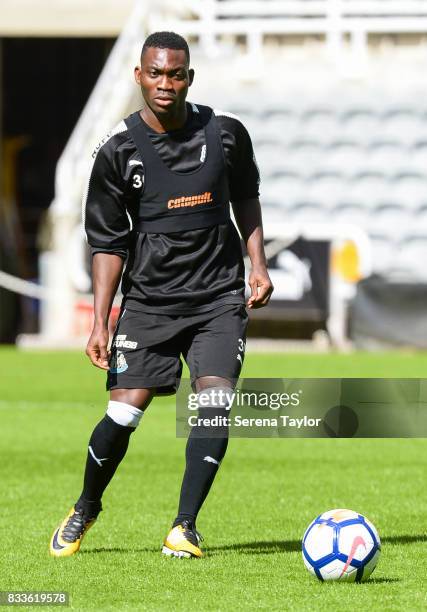 Christian Atsu looks to pass the ball during a Newcastle United Open Training session at St.James' Park on August 17 in Newcastle upon Tyne, England.