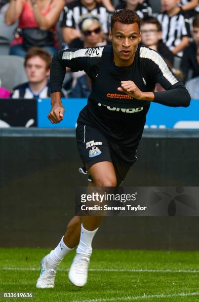 Isaac Hayden runs with the ball during a Newcastle United Open Training session at St.James' Park on August 17 in Newcastle upon Tyne, England.