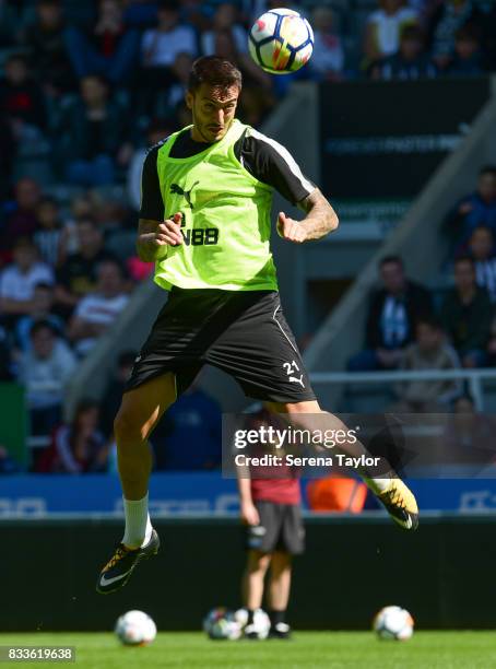 Joselu heads the ball during a Newcastle United Open Training session at St.James' Park on August 17 in Newcastle upon Tyne, England.