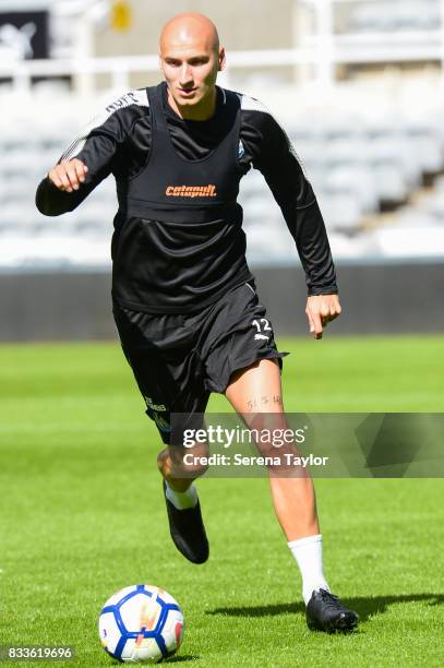 Jonjo Shelvey runs with the ball during a Newcastle United Open Training session at St.James' Park on August 17 in Newcastle upon Tyne, England.