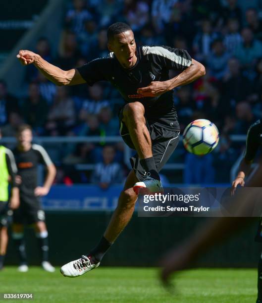 Isaac Hayden kicks the ball during a Newcastle United Open Training session at St.James' Park on August 17 in Newcastle upon Tyne, England.