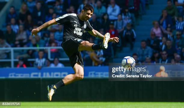 Aleksandar Mitrovic strikes the ball during a Newcastle United Open Training session at St.James' Park on August 17 in Newcastle upon Tyne, England.