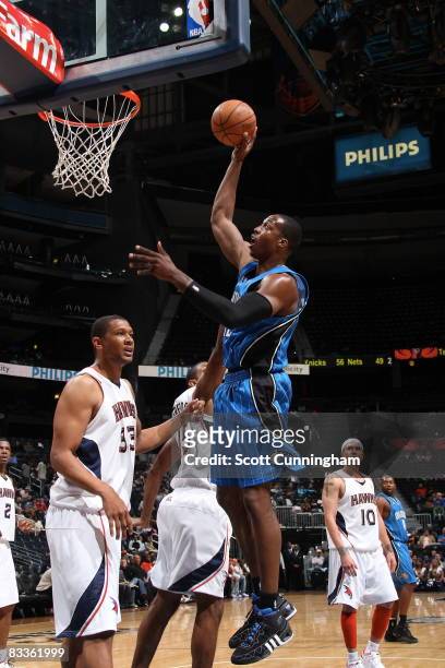 Dwight Howard of the Orlando Magic takes a shot against the Atlanta Hawks at Philips Arena on October 20, 2008 in Atlanta, Georgia. NOTE TO USER:...