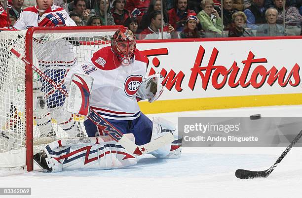 Jaroslav Halak of the Montreal Canadiens focuses on the puck on a shot by the Florida Panthers at the Bell Centre on October 20, 2008 in Montreal,...