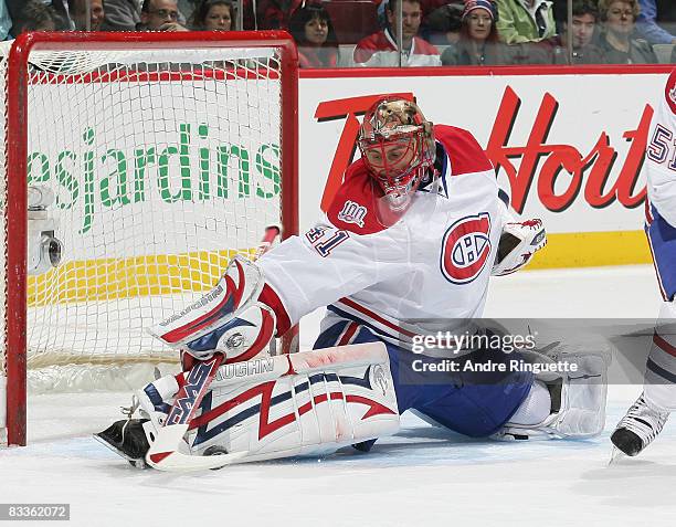 Jaroslav Halak of the Montreal Canadiens reaches and makes a pad save against the Florida Panthers at the Bell Centre on October 20, 2008 in...