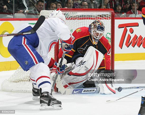 Tomas Vokoun of the Florida Panthers gets the paddle down and makes a save against Saku Koivu of the Montreal Canadiens at the Bell Centre on October...