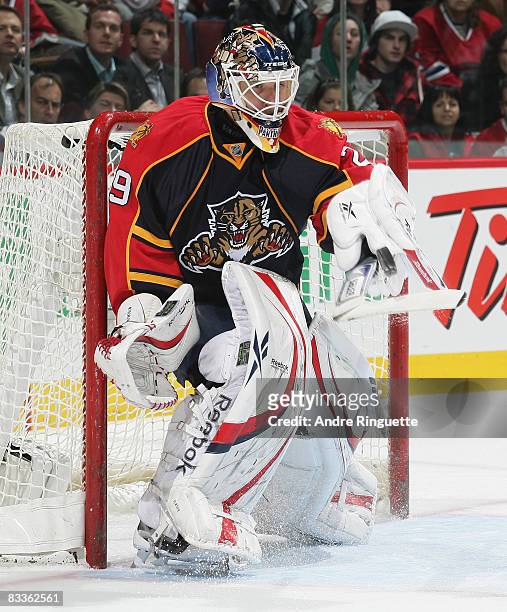 Tomas Vokoun of the Florida Panthers tips the puck up with the blade of his stick after a shot by the Montreal Canadiens at the Bell Centre on...