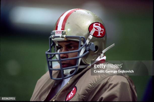 Safety Ronnie Lott of the San Francisco 49ers looks on from the sideline during a game against the Cleveland Browns at Municipal Stadium on November...