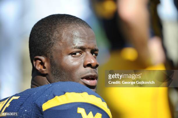 Running back Noel Devine of the West Virginia University Mountaineers looks on from the sideline during a college football game against the Syracuse...