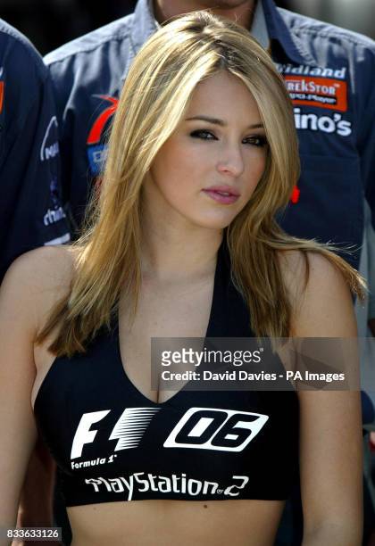 Model Keeley Hazell poses on the Midland F1 Racing car before the British Grand Prix at Silverstone.