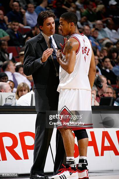 Head coach Vinny Del Negro talks to Derrick Rose of the Chicago Bulls during the preseason game against the Minnesota Timberwolves at the United...