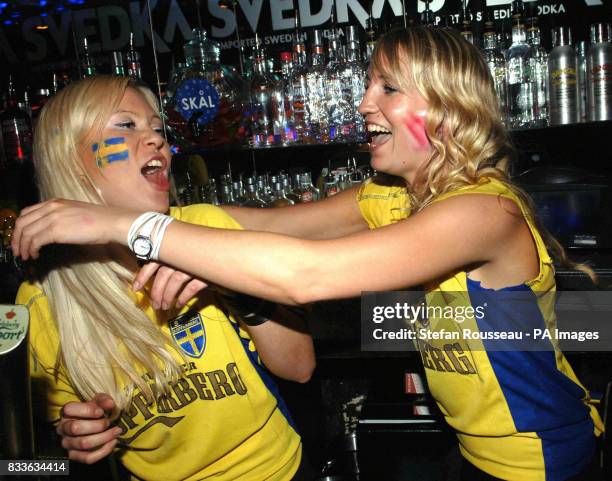 Swedish fans celebrate as Sweden equalise during the FIFA World Cup Group B game between England and Sweden in Germany at the Nordic Bar, London.