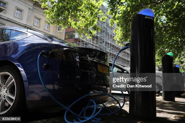 Charging plug connects an electric vehicle to a charging station on August 17, 2017 in London, England. A study commissioned by power generation...