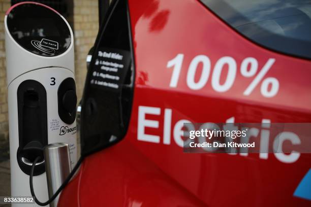 Charging plug connects an electric vehicle to a charging station on August 17, 2017 in London, England. A study commissioned by power generation...