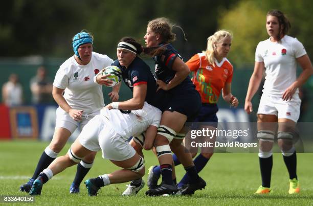 Abby Gustaitis of USA is tackled during the Women's Rugby World Cup Pool B match between England and USA at Billings Park UCB on August 17, 2017 in...