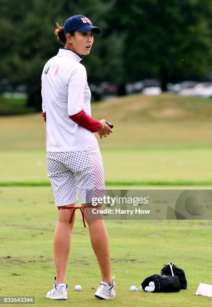 Michelle Wie of the United States wears a training aid on her legs during practice for the Solheim Cup at the Des Moines Golf and Country Club on...