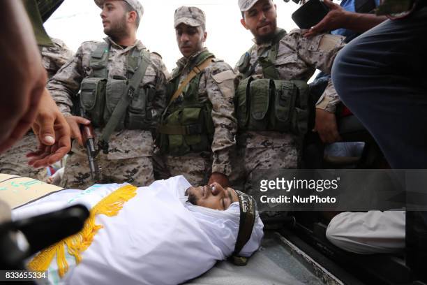 Mourners and Hamas militants carry the body of Nidal al-Jaafari, a 28-year-old field commander who was killed overnight in a suicide attack that...
