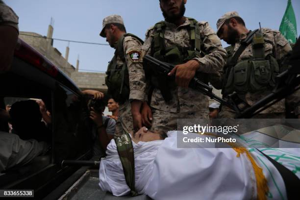 Mourners and Hamas militants carry the body of Nidal al-Jaafari, a 28-year-old field commander who was killed overnight in a suicide attack that...