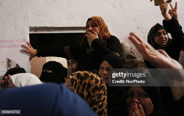 Mourners and Hamas militants carry the body of Nidal al-Jaafari, a 28-year-old field commander who was killed overnight in a suicide attack that...