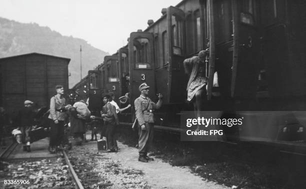 The children of partisan parents from Celje, Yugoslavia , arrive in Frohnleiten, Austria, where they are met by German military police officers,...