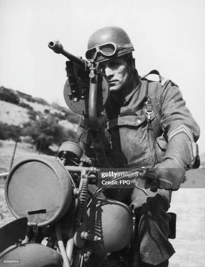 Machine Gun Assault Rider A British Grenadier guardsman aiming a Thompson sub-machine gun ...