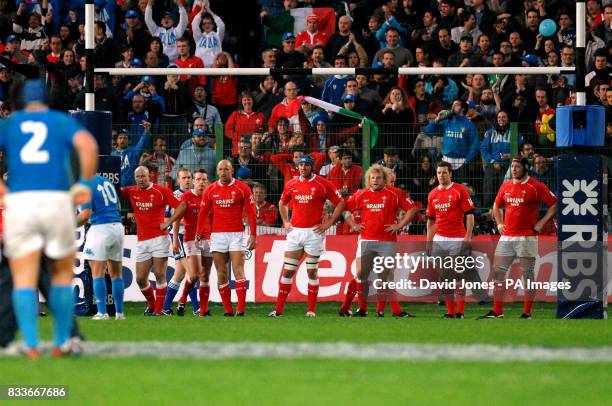 Wales players line up under their posts as Italy's Ramiro Pez seals victory with a conversion during the RBS 6 Nations match at the Stadio Flaminio,...