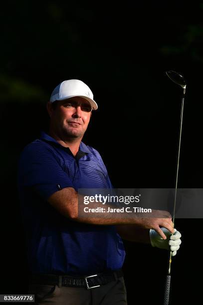 Steven Bowditch of Australia plays his tee shot on the second hole during the first round of the Wyndham Championship at Sedgefield Country Club on...