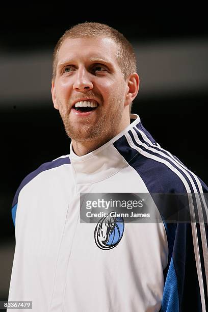 Dirk Nowitzki of the Dallas Mavericks smiles on the court during the preseason game against the Washington Wizards on October 7, 2008 at the American...