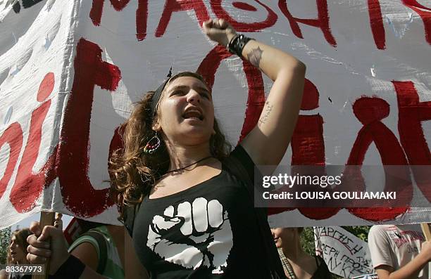 High-school student shouts slogans in front of Greek Parliament, during a demonstration in central Athens marking the 24-hours strike against the...