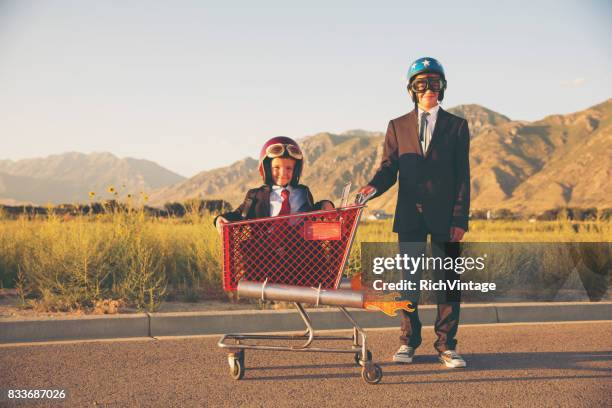 young business team races shopping cart - helmet cart stock pictures, royalty-free photos & images