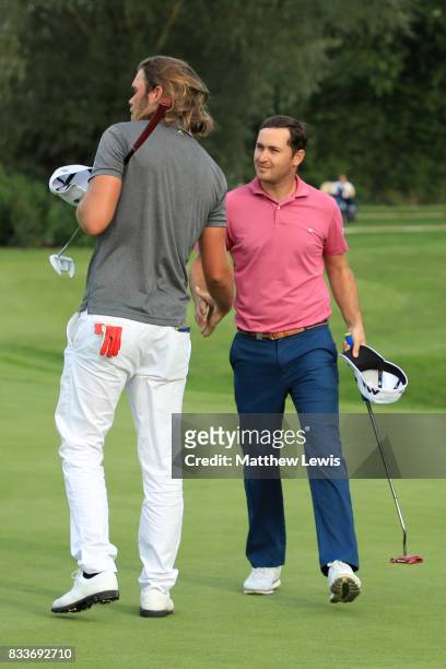 Daniel Brooks of England congratulates Johan Carlsson of Sweden on his victory on the 17th green during round one of the Saltire Energy Paul Lawrie...