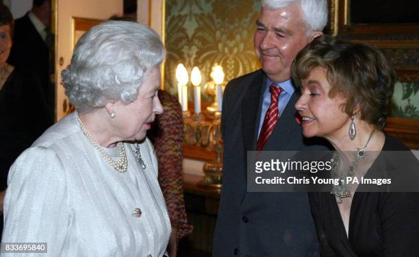 Britain's Queen Elizabeth II greets actress Prunella Scales during a reception at St. James Palace, London, for the Campaign to Protect Rural...