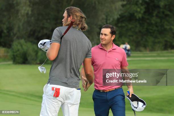 Daniel Brooks of England congratulates Johan Carlsson of Sweden on his victory on the 17th green during round one of the Saltire Energy Paul Lawrie...