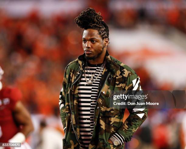 Former Alabama Crimson Tide running back and Heisman Trophy winner Derrick Henry stands on the field prior to the 2017 College Football Playoff...