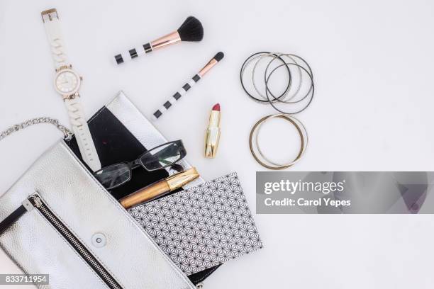 content of woman bag.overhead shot - table of content stock pictures, royalty-free photos & images