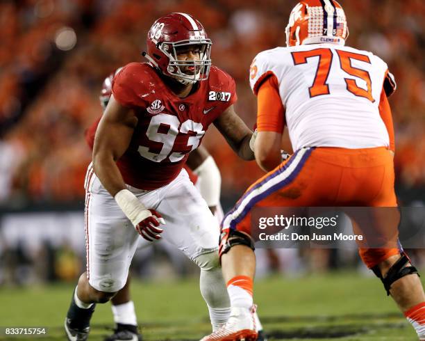 Defensive End Jonathan Allen of the Alabama Crimson Tide is being blocked by Tackle Mitch Hyatt of the Clemson Tigers during the 2017 College...