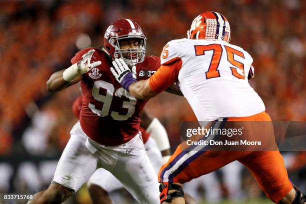 Defensive End Jonathan Allen of the Alabama Crimson Tide is being blocked by Tackle Mitch Hyatt of the Clemson Tigers during the 2017 College...